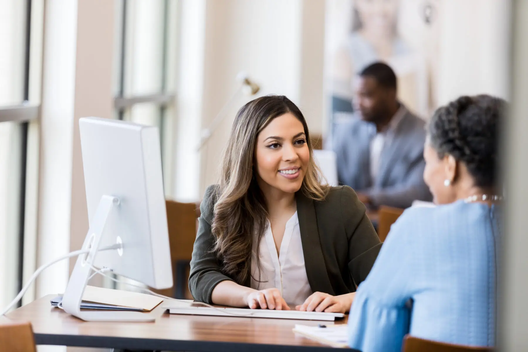 Business woman speaking to credit union member