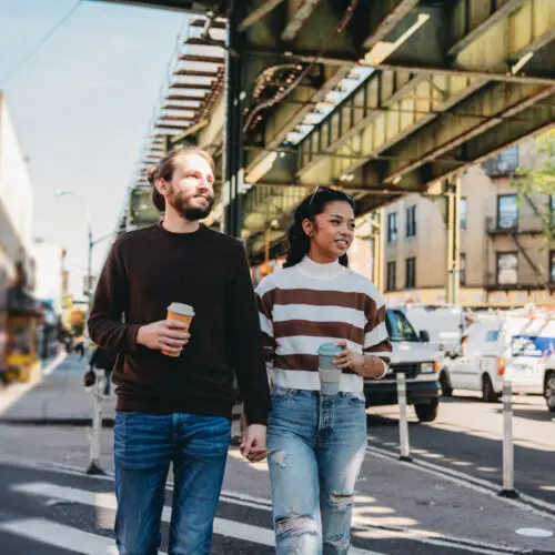 couple walking down a city street