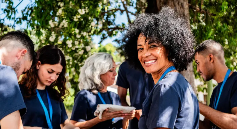 Portrait of mature volunteer woman outdoors