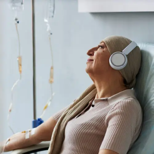 senior woman listening to music during treatment i 2026 03 20 01 02 24 utc